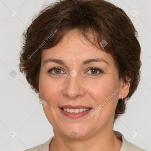 Joyful white adult female with short  brown hair and brown eyes