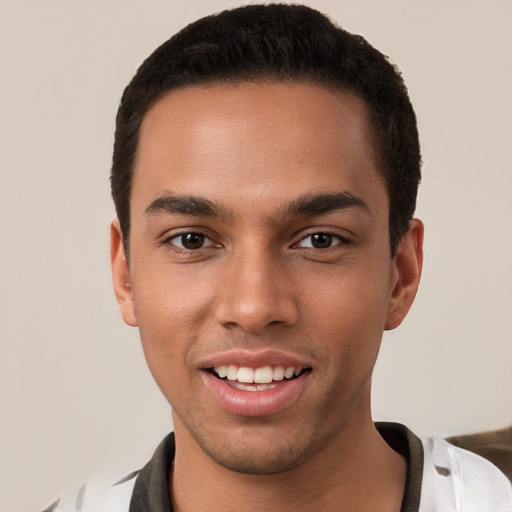 Joyful white young-adult male with short  black hair and brown eyes