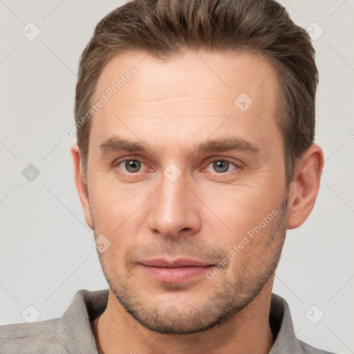 Joyful white adult male with short  brown hair and brown eyes