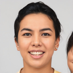 Joyful asian young-adult female with short  black hair and brown eyes