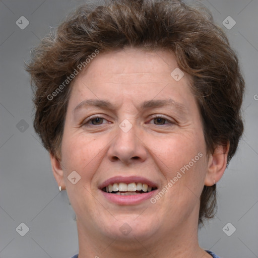 Joyful white adult female with short  brown hair and brown eyes