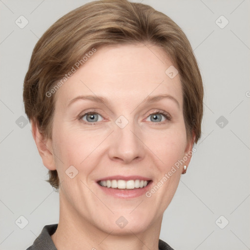 Joyful white adult female with short  brown hair and grey eyes