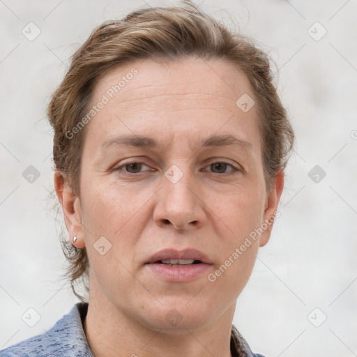 Joyful white adult female with short  brown hair and grey eyes