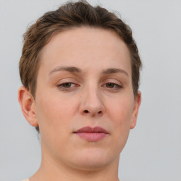 Neutral white young-adult female with short  brown hair and brown eyes