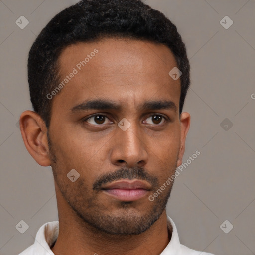 Neutral latino young-adult male with short  black hair and brown eyes