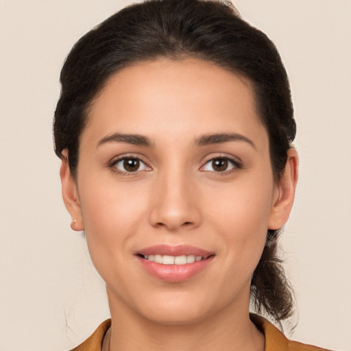 Joyful white young-adult female with long  brown hair and brown eyes