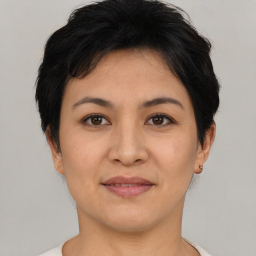 Joyful asian young-adult female with short  brown hair and brown eyes