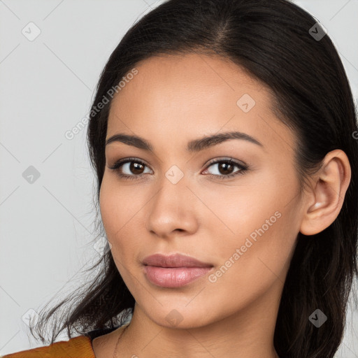 Joyful latino young-adult female with long  brown hair and brown eyes