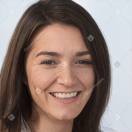 Joyful white adult female with long  brown hair and brown eyes