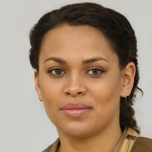 Joyful black young-adult female with short  brown hair and brown eyes