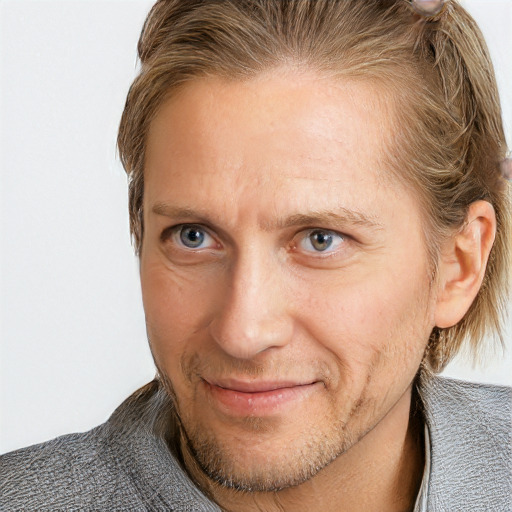 Joyful white adult male with short  brown hair and grey eyes