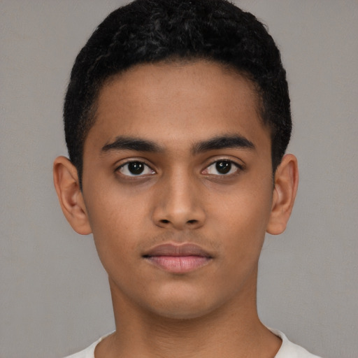 Neutral latino young-adult male with short  black hair and brown eyes