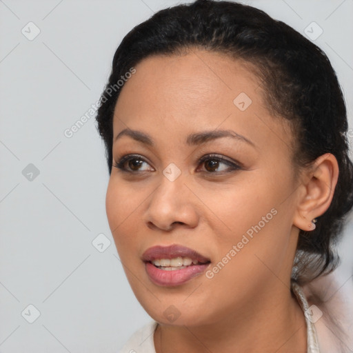 Joyful latino young-adult female with short  black hair and brown eyes