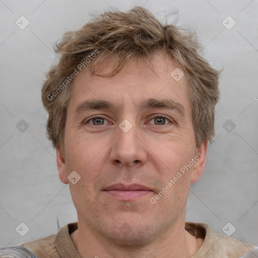 Joyful white adult male with short  brown hair and grey eyes