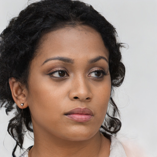 Neutral latino young-adult female with long  brown hair and brown eyes