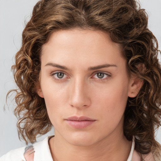 Neutral white young-adult female with medium  brown hair and green eyes