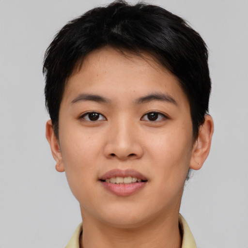 Joyful asian young-adult female with short  brown hair and brown eyes