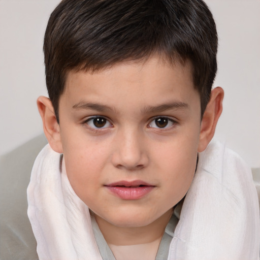 Joyful white child male with short  brown hair and brown eyes