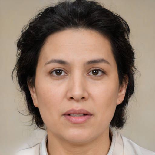 Joyful asian adult female with medium  brown hair and brown eyes