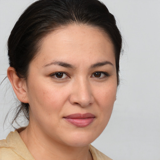 Joyful white young-adult female with medium  brown hair and brown eyes