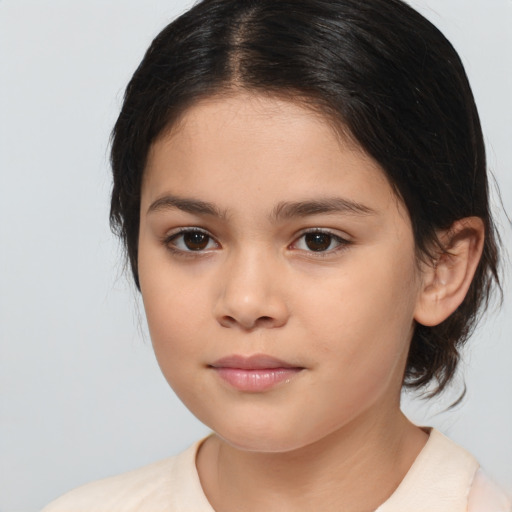 Joyful white child female with medium  brown hair and brown eyes