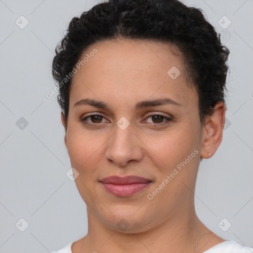 Joyful latino young-adult female with short  brown hair and brown eyes