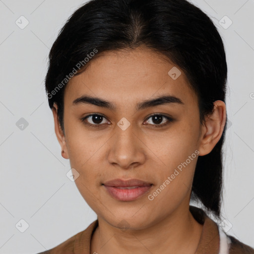 Joyful latino young-adult female with medium  brown hair and brown eyes