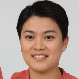 Joyful asian young-adult female with short  brown hair and brown eyes