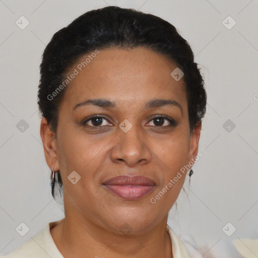 Joyful black adult female with short  brown hair and brown eyes