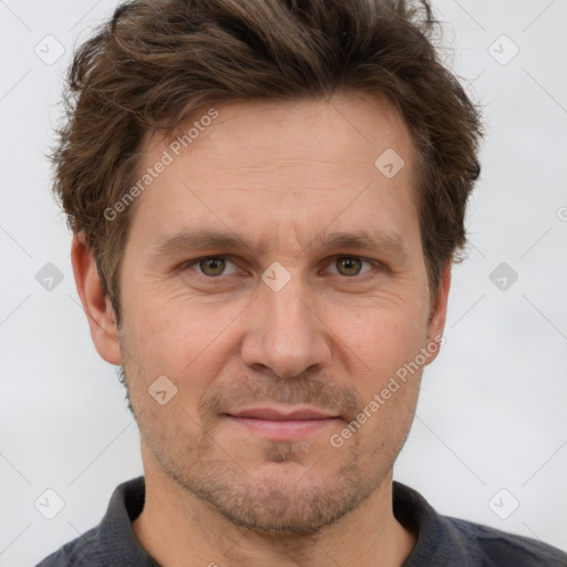 Joyful white adult male with short  brown hair and grey eyes