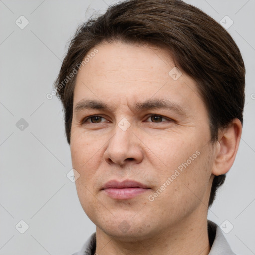 Joyful white adult male with short  brown hair and brown eyes