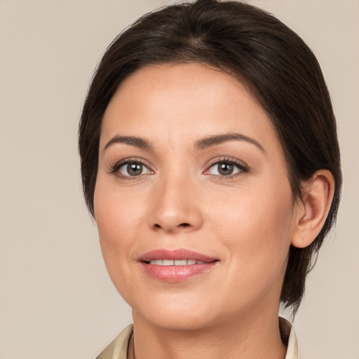 Joyful white young-adult female with medium  brown hair and brown eyes