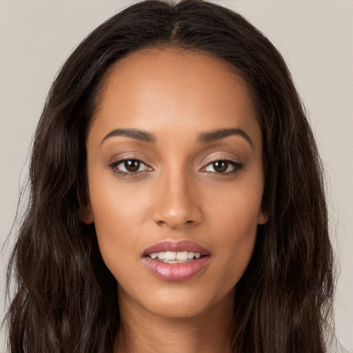 Joyful white young-adult female with long  brown hair and brown eyes