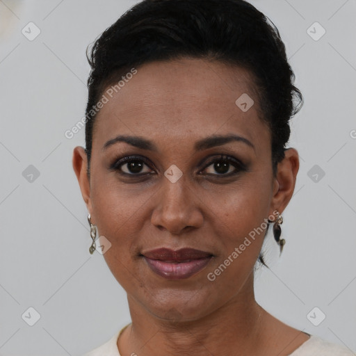 Joyful black young-adult female with short  brown hair and brown eyes