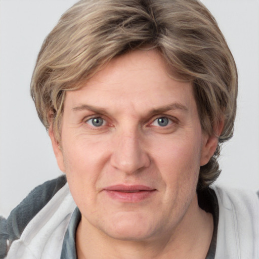 Joyful white adult male with medium  brown hair and grey eyes