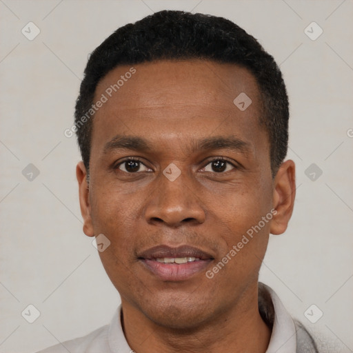 Joyful black young-adult male with short  black hair and brown eyes