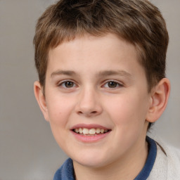 Joyful white child male with short  brown hair and brown eyes