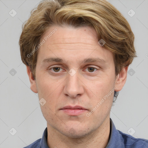 Joyful white adult male with short  brown hair and grey eyes