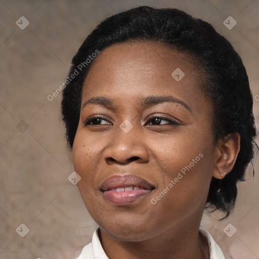 Joyful black adult female with medium  black hair and brown eyes