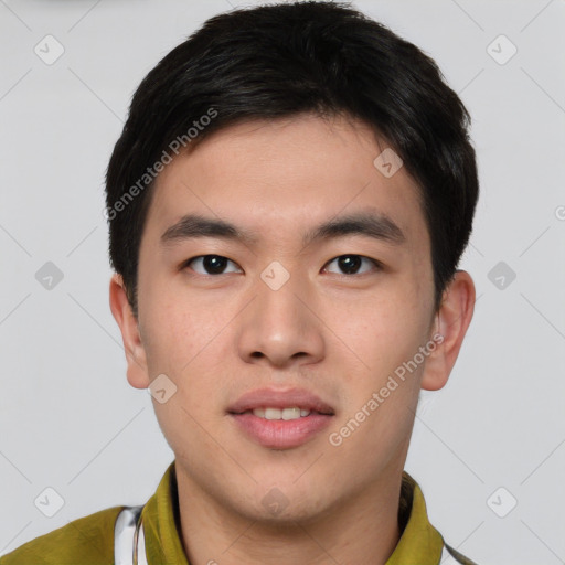 Joyful asian young-adult male with short  brown hair and brown eyes