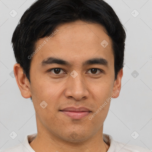 Joyful asian young-adult male with short  brown hair and brown eyes