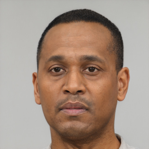 Neutral black adult male with short  black hair and brown eyes