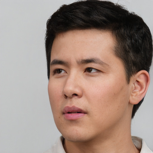 Neutral asian young-adult male with short  black hair and brown eyes