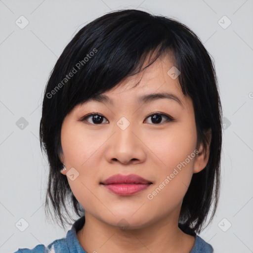 Joyful asian young-adult female with medium  black hair and brown eyes