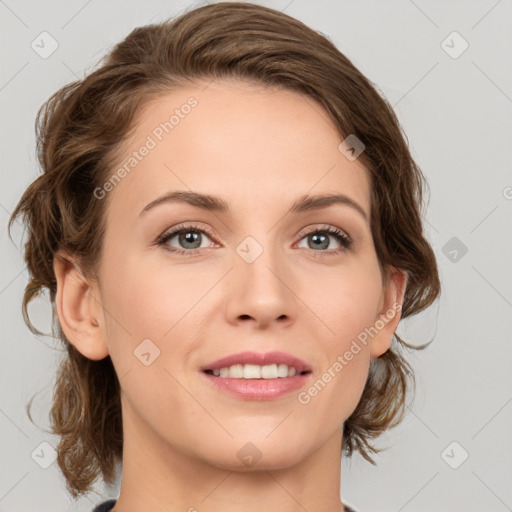 Joyful white young-adult female with medium  brown hair and green eyes