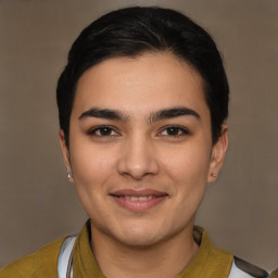 Joyful latino young-adult male with short  brown hair and brown eyes