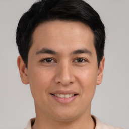 Joyful asian young-adult male with short  brown hair and brown eyes