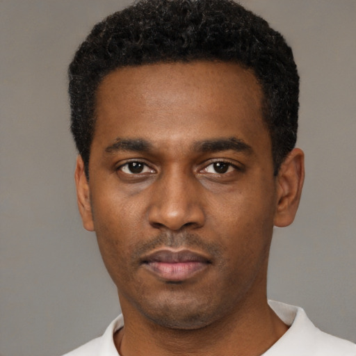 Neutral black young-adult male with short  black hair and brown eyes