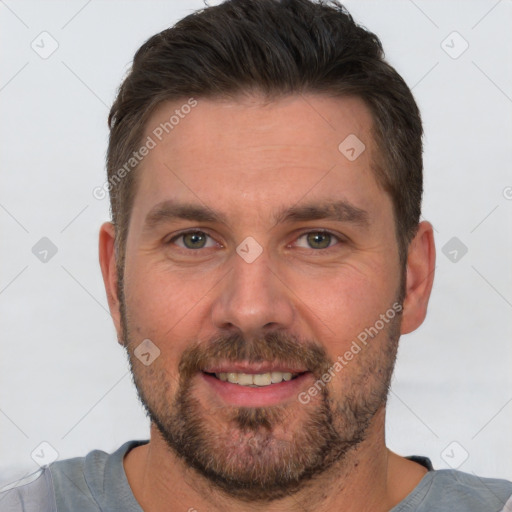 Joyful white adult male with short  brown hair and brown eyes