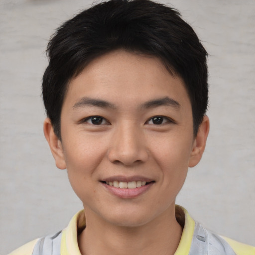 Joyful asian young-adult female with short  brown hair and brown eyes